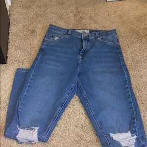 Blue jeans with holes in knees